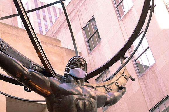 Statue of Atlas wearing a face mask at Rockefeller Center