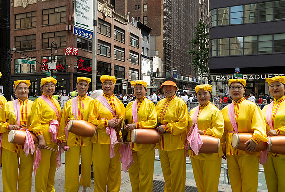 Chinese American women with drums during the Dominican Day Parade