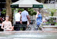 Woman reading by the Fountain in Bryant Park