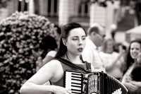 A woman singing and playing the accordion in Bryant Park, NY