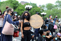 A woman holding a sign during a protest against police violence, Union Square, New York City