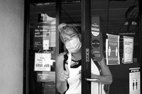 Masked woman at her Shop