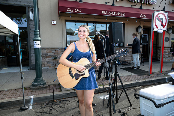 Young woman performing at a street fair